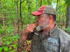 Craig Caudill signals for help with a survival whistle