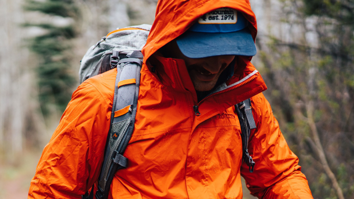 Male backpacker wearing Marmot rain jacket