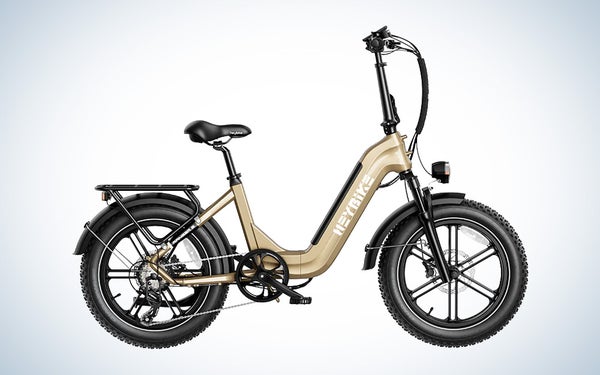 The metallic sand colorway of the Heybike Ranger S folding electronic bike against a black and white gradient background.