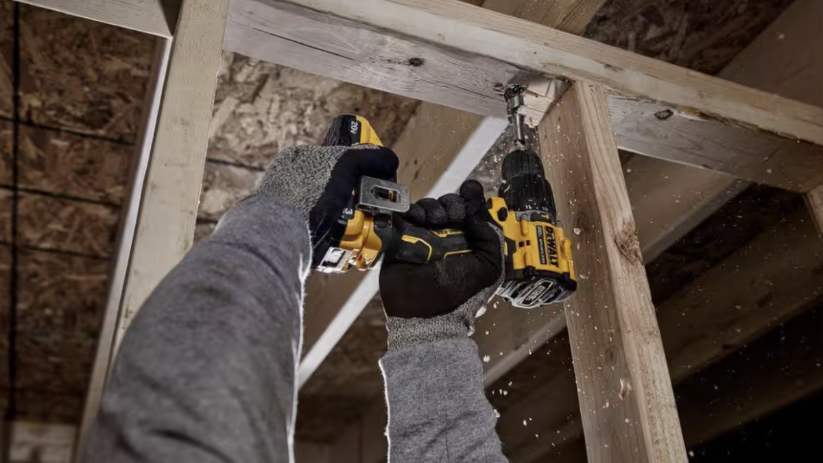 Man using DeWalt 20V Max Cordless Hammer Drill on home renovation