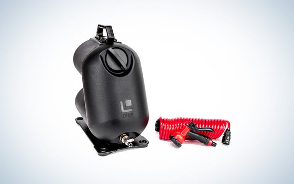 The Leitner HydroPod portable shower tank with a red hose and sprayer isolated on a black and white gradient background.