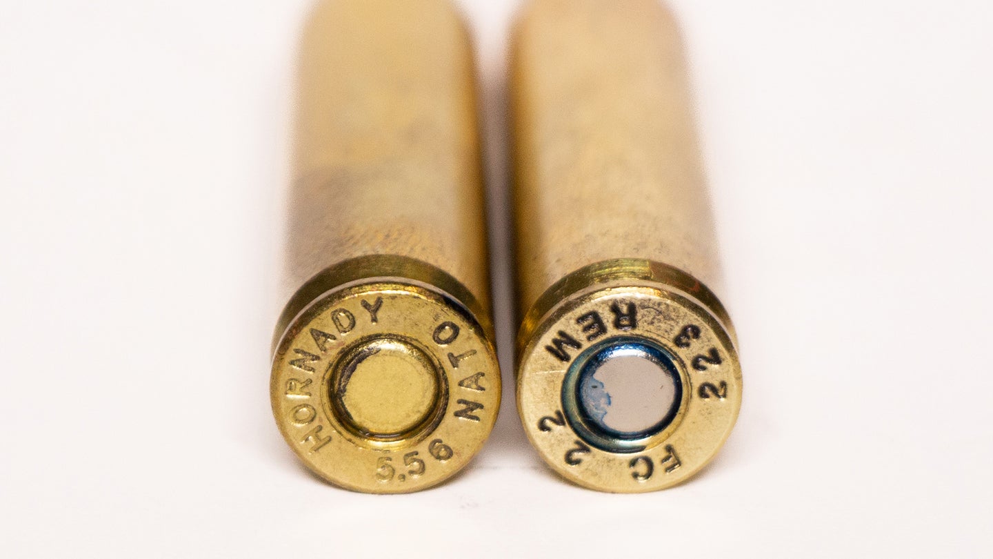 A 556 cartridge on the right and 223 cartridge on the left, against a white background.