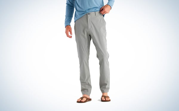 A pair of grey Free Fly Latitude pants on a black and white gradient background.