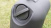 The round pressurizing cap of the Leitner HydroPod portable shower on a green grass background. 