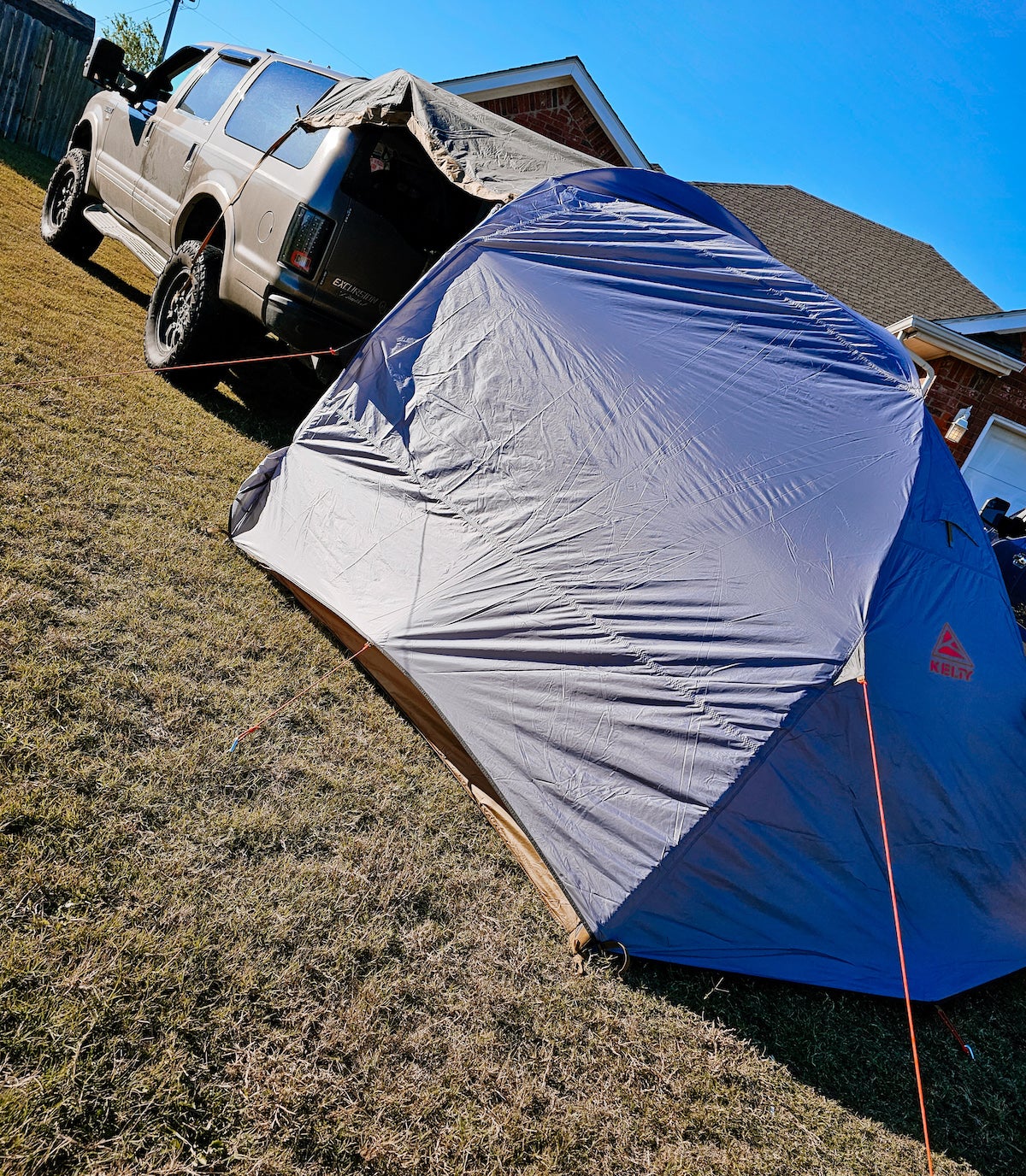 Kelty Caboose 4 SUV Tent attached to back of Ford Excursion