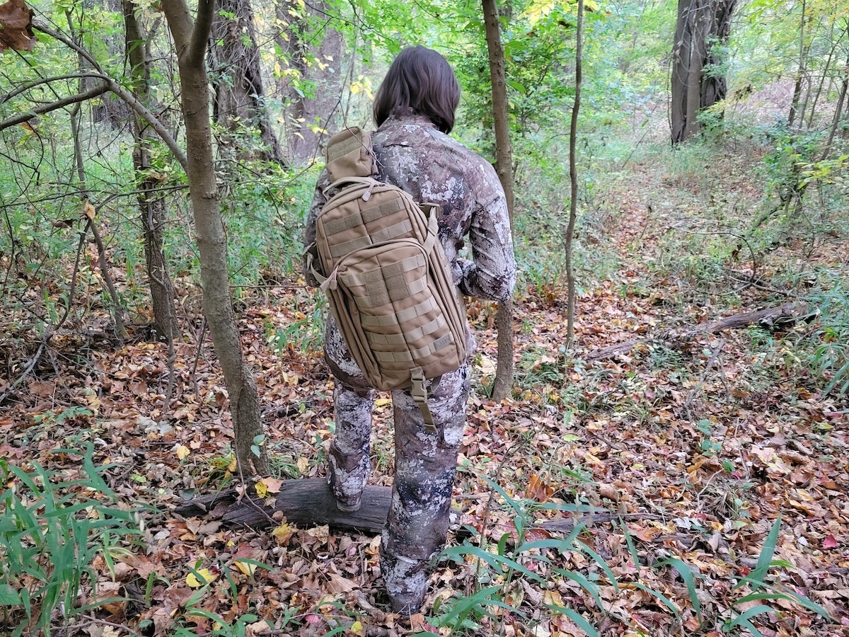 Female hunter wearing 5.11 Tactical Rush Moab Sling Pack