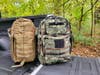 5.11 Tactical Rush and Rush MOAB backpacks sitting on truck tailgate
