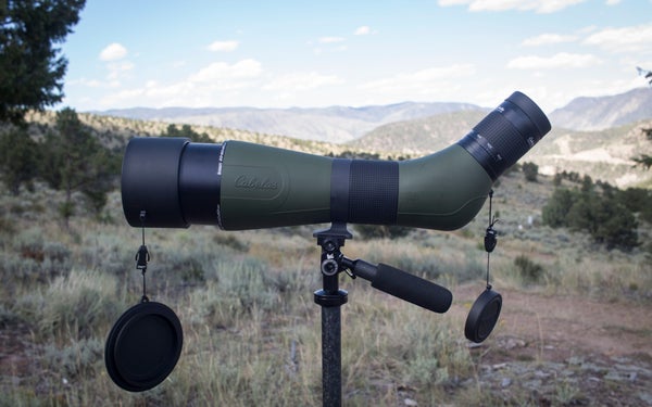 Cabela's Spotting Scope on tripod with mountains in the background