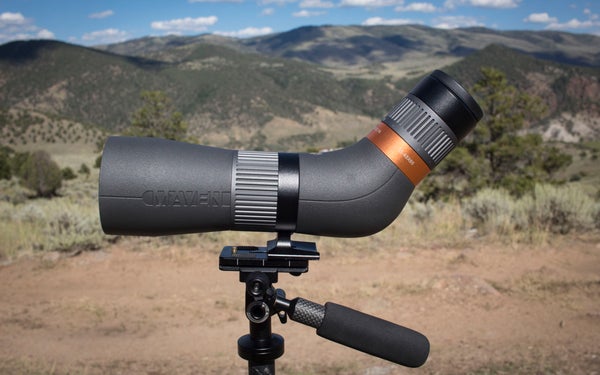 Maven CS.1A spotting scope on tripod with mountains in the background