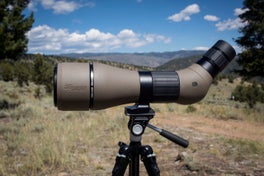 Sig Sauer Oscar 8 spotting scope on tripod with mountains in the background