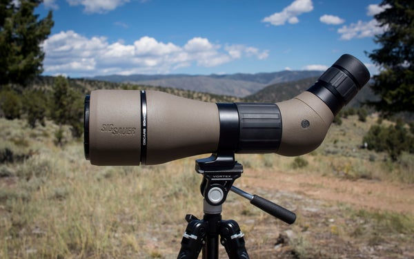 Sig Sauer Oscar 8 spotting scope on tripod with mountains in the background