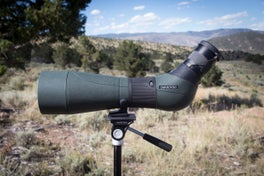 Swarovski ATS 80 spotting scope on tripod with mountains in the background