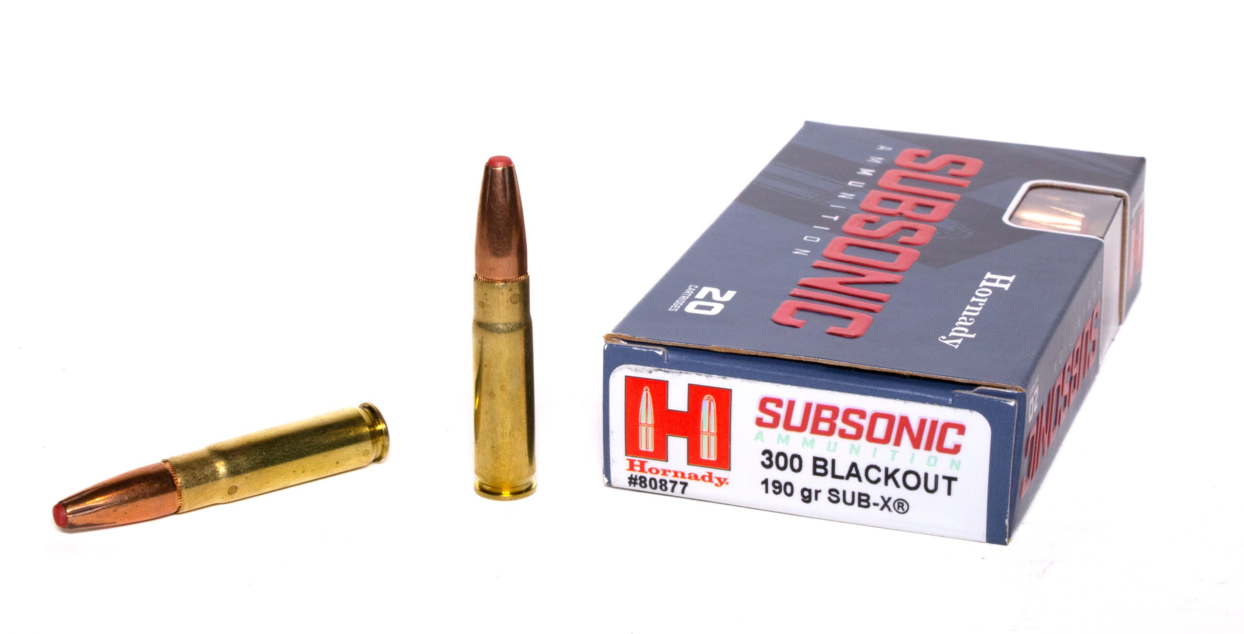 A box of 300 Blackout ammo and two loose cartridges on a white background.
