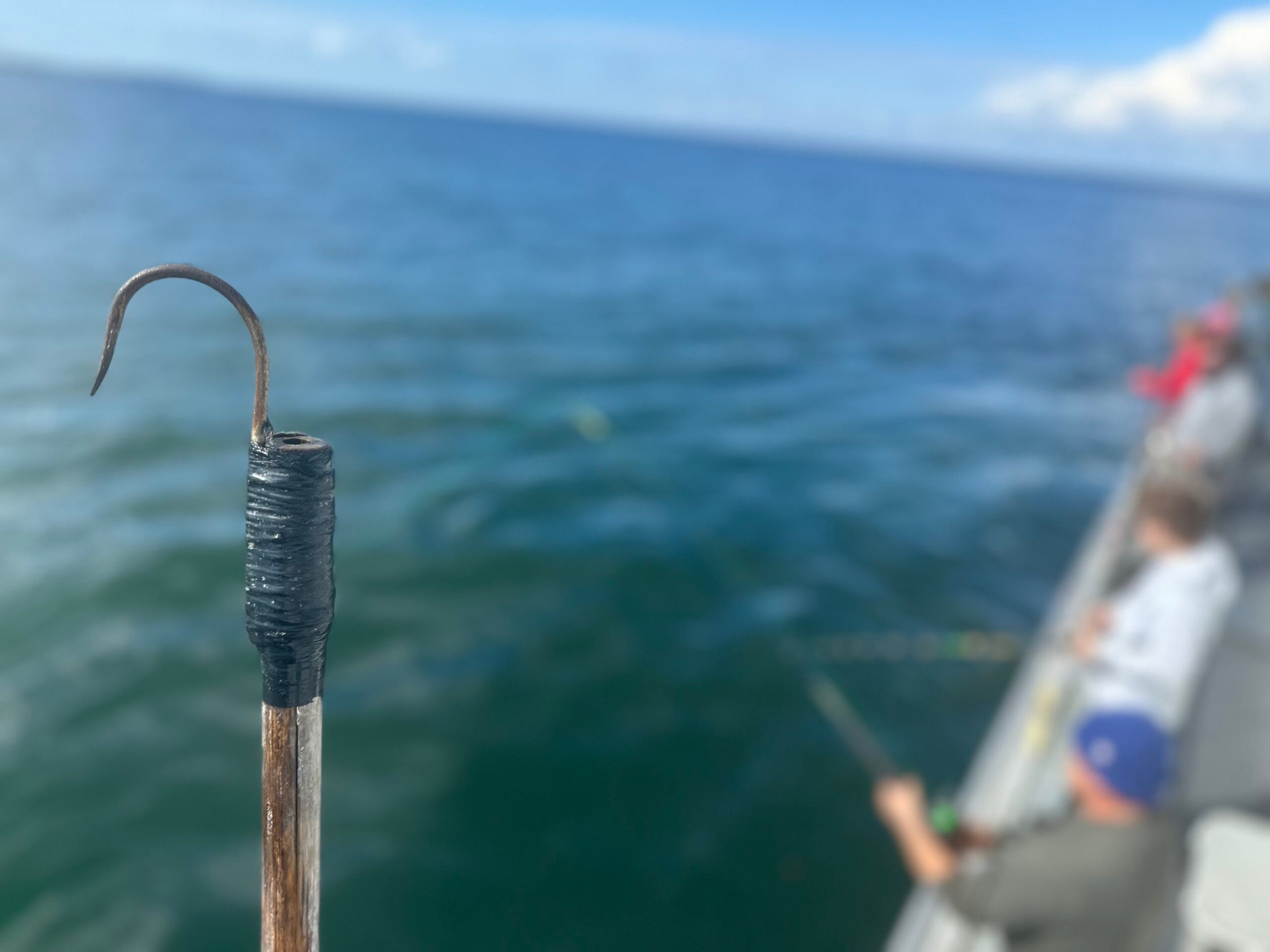 A gaff hook used for hooking fish is shown on a party boat.