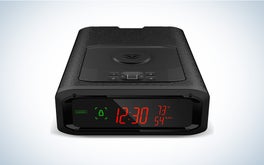 A black Vaultek biometric smart station handgun safe on a black and white gradient background.