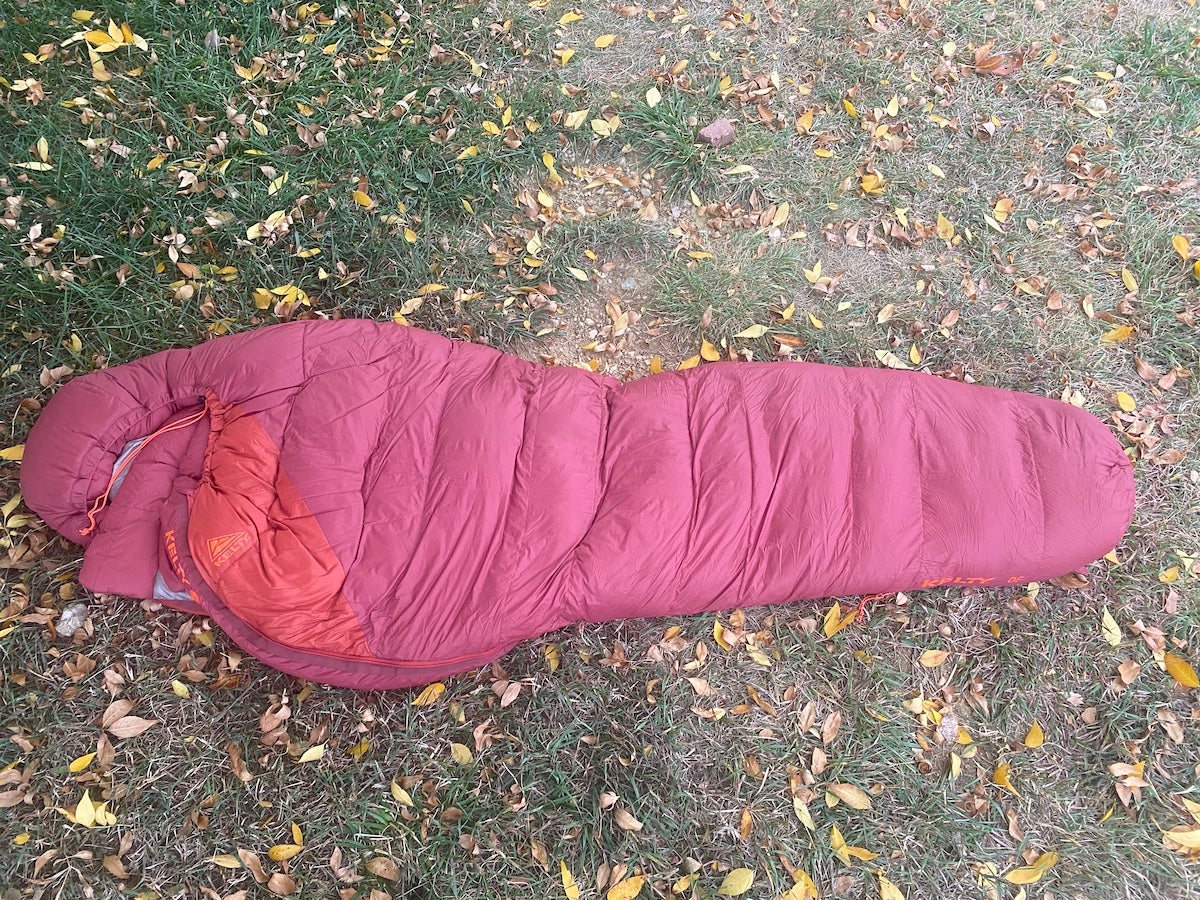 Kelty Cosmic Down 0 Sleeping Bag laid out on grass