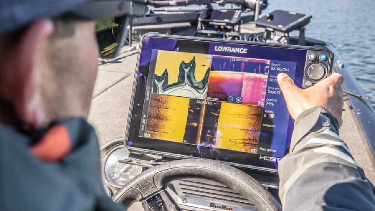Angler using Lowrance fish finder on boat