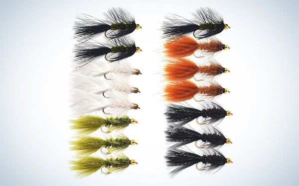 A collection of Woolly Bugger trout flies in white, black, brown, and olive.