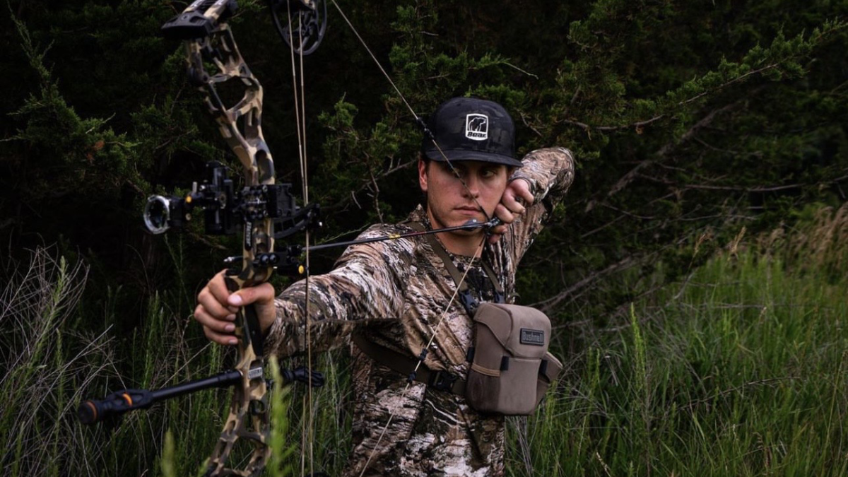 Hunter shooting Bear Archery Compound Bow
