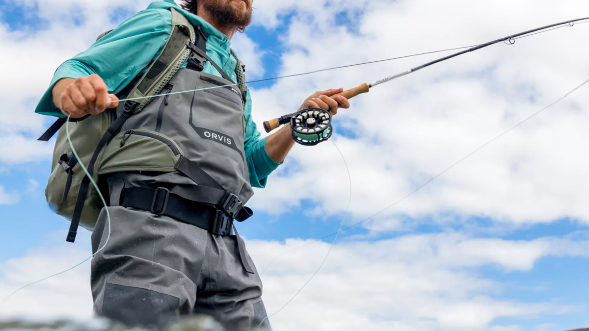 Angler fly fishing while wearing Orvis Pro waders