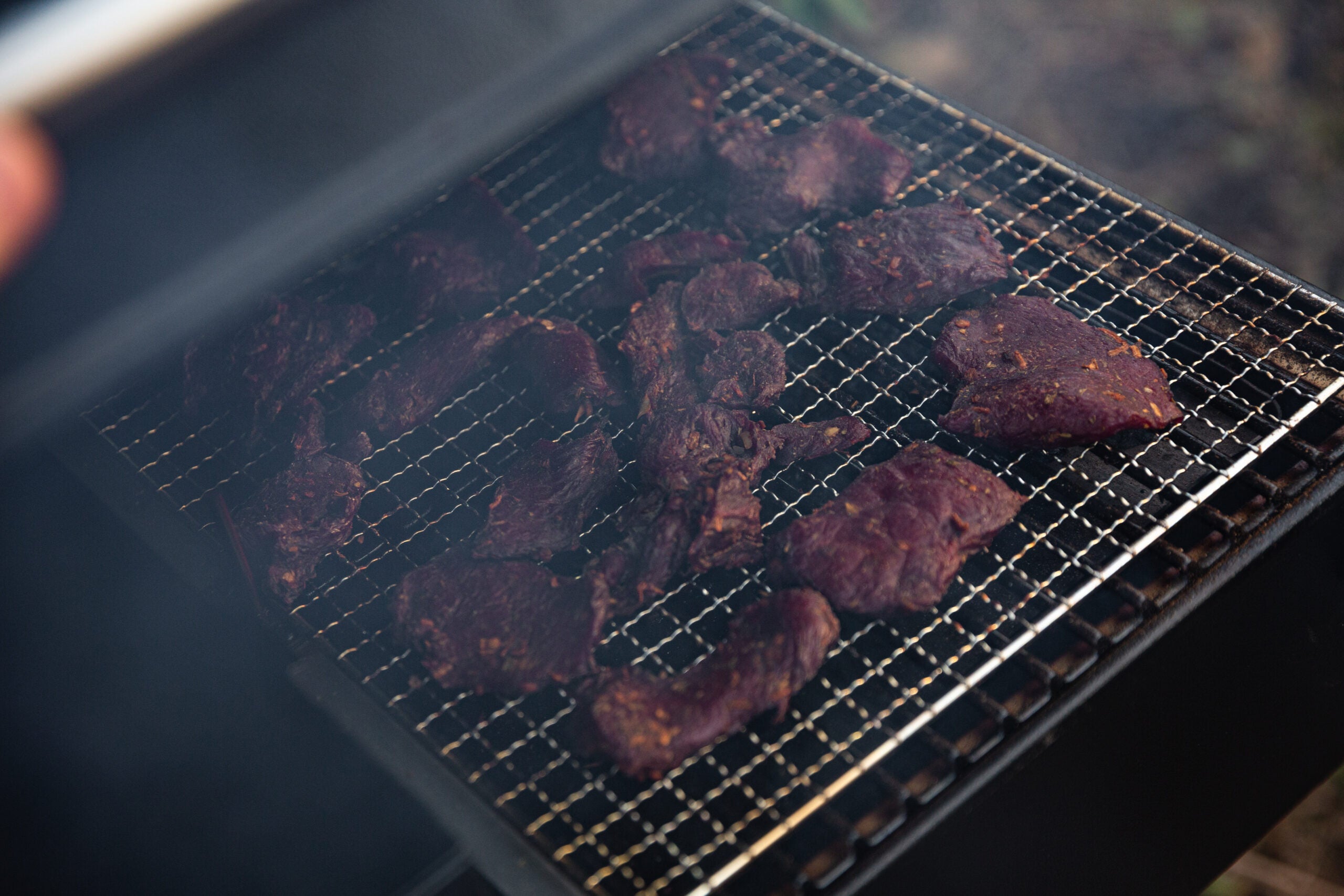 Photo of meat in a pellet grill