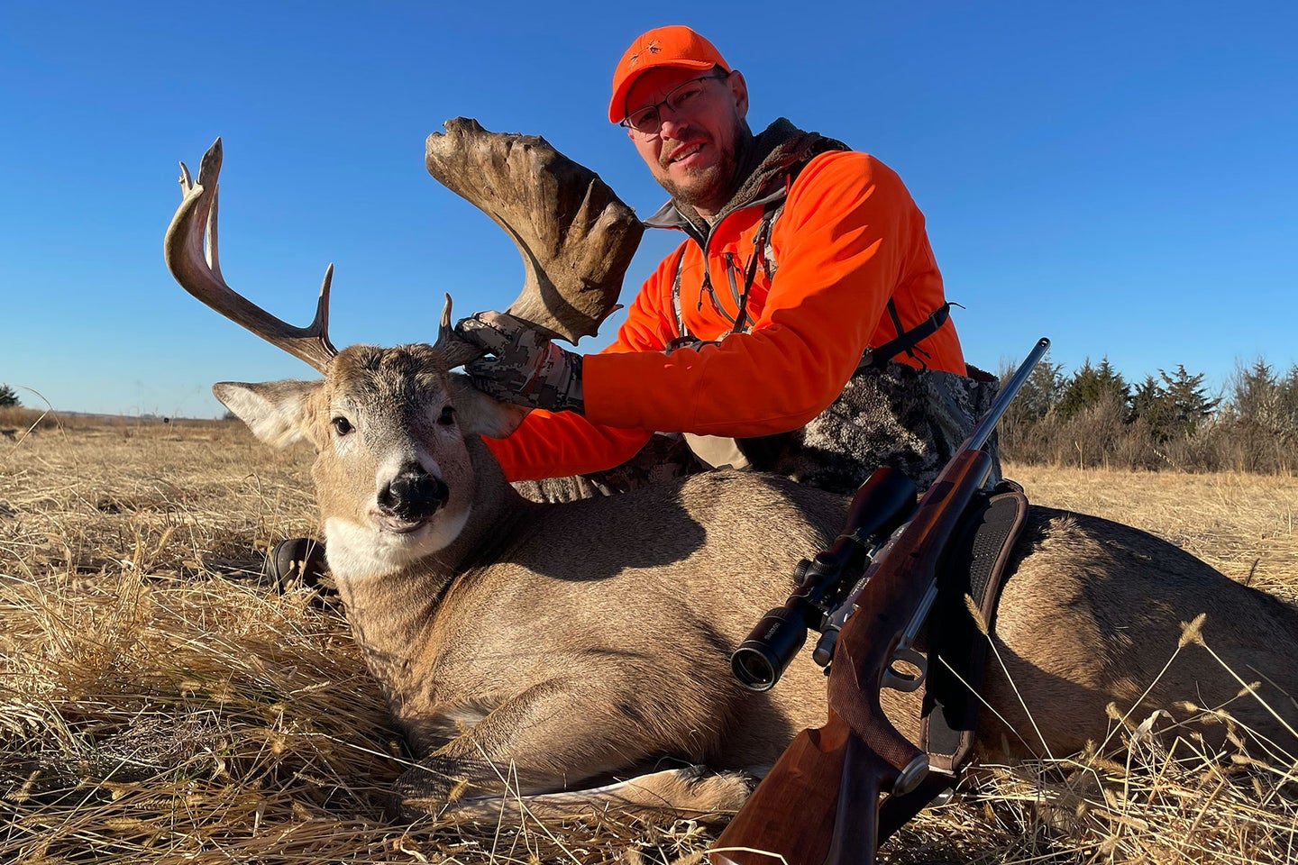 A hunter poses with an odd-looking South Dakota buck.
