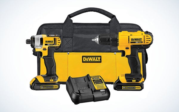 A Yellow DeWalt drill and Impact Wrench with batteries, battery charger, and tool bag against a gray background.