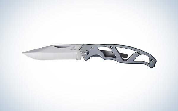 A silver Gerber Gear Paraframe knife on a black and white gradient background.