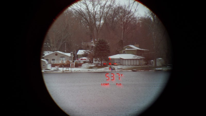 The view through the Maven CRF.1 rangefinder across a lake with snowy homes in the background. 
