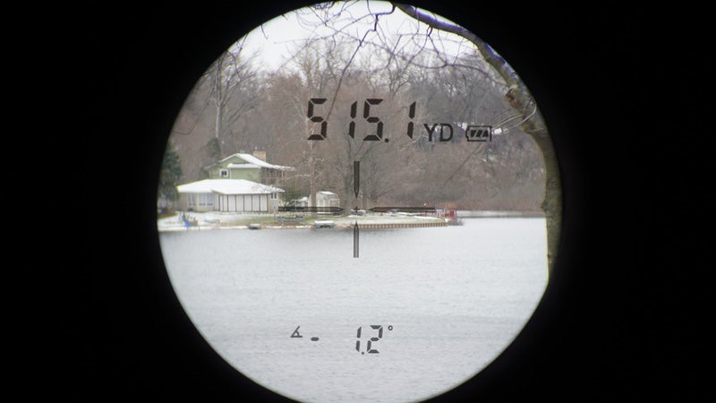 The view through a Ravin 1200 rangefinder of a shoreline across a lake. 