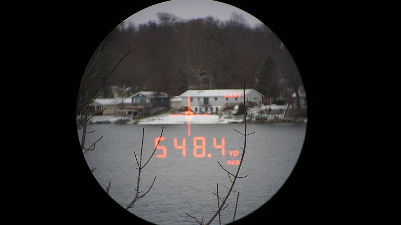 The view through a Vortex Crossfire HD rangefinder of a home on the opposite side of a lake. 