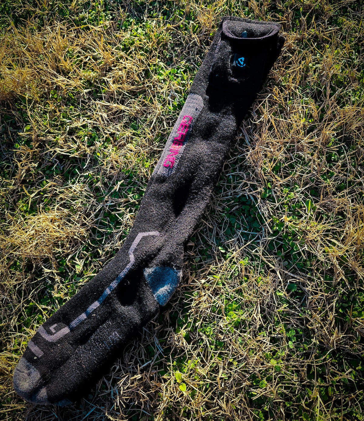 Pair of Gerbing heated socks lying on grass