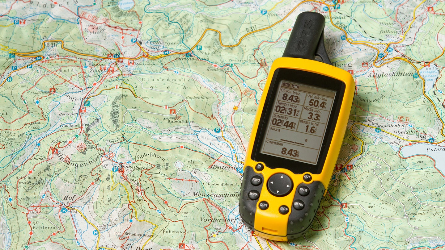 Photo of a GPS on top of a topographic map