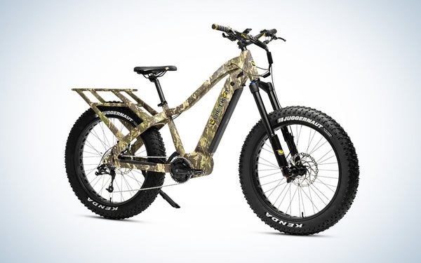 A camo Quiet Kat Apex Pro electric bike for hunting on a black and white gradient background.