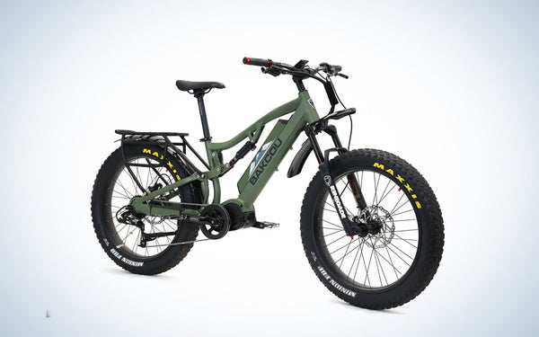A green Bakcou Storm electric hunting bike on a black and white gradient background.