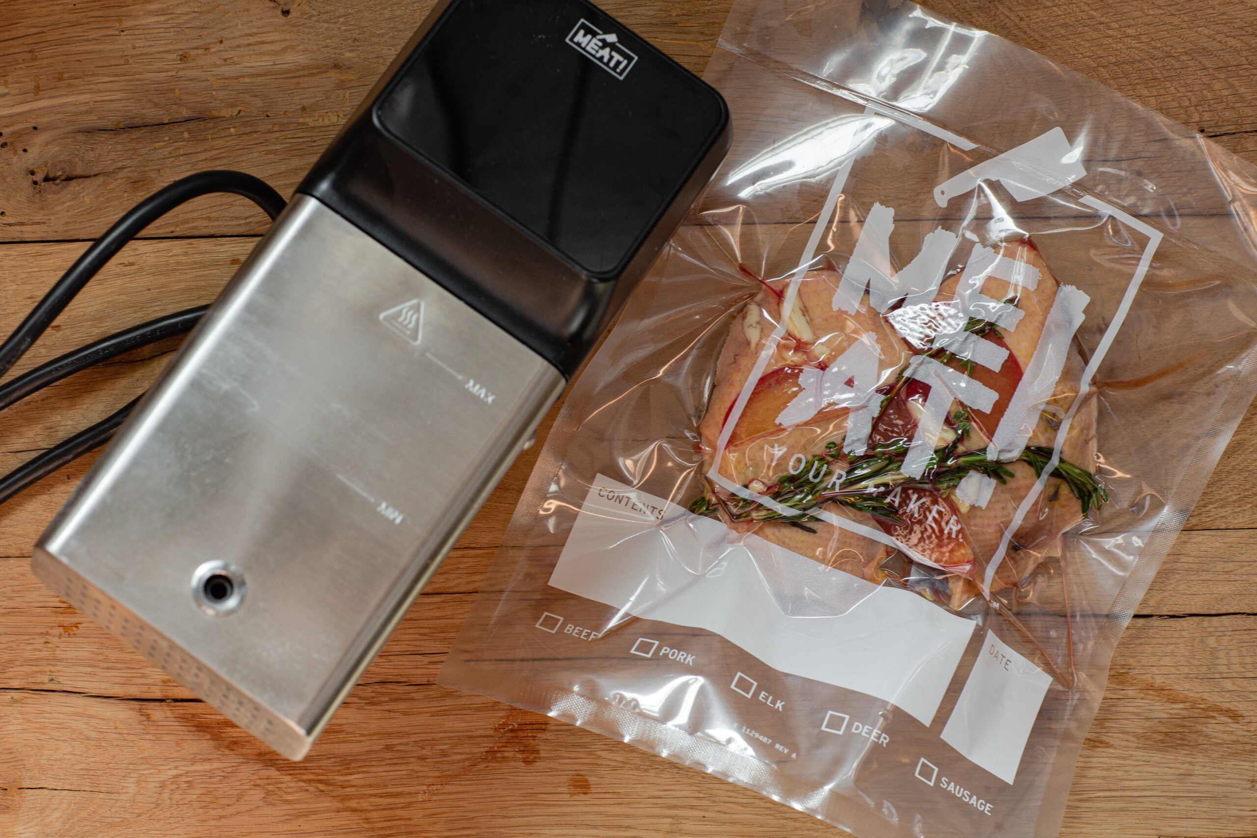 Duck breast sealed in a vacuum-sealed bag in preparation for sous vide cooking