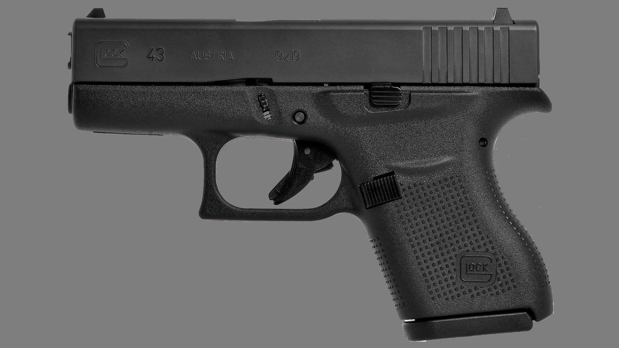 Glock 43 pistol on a gray background