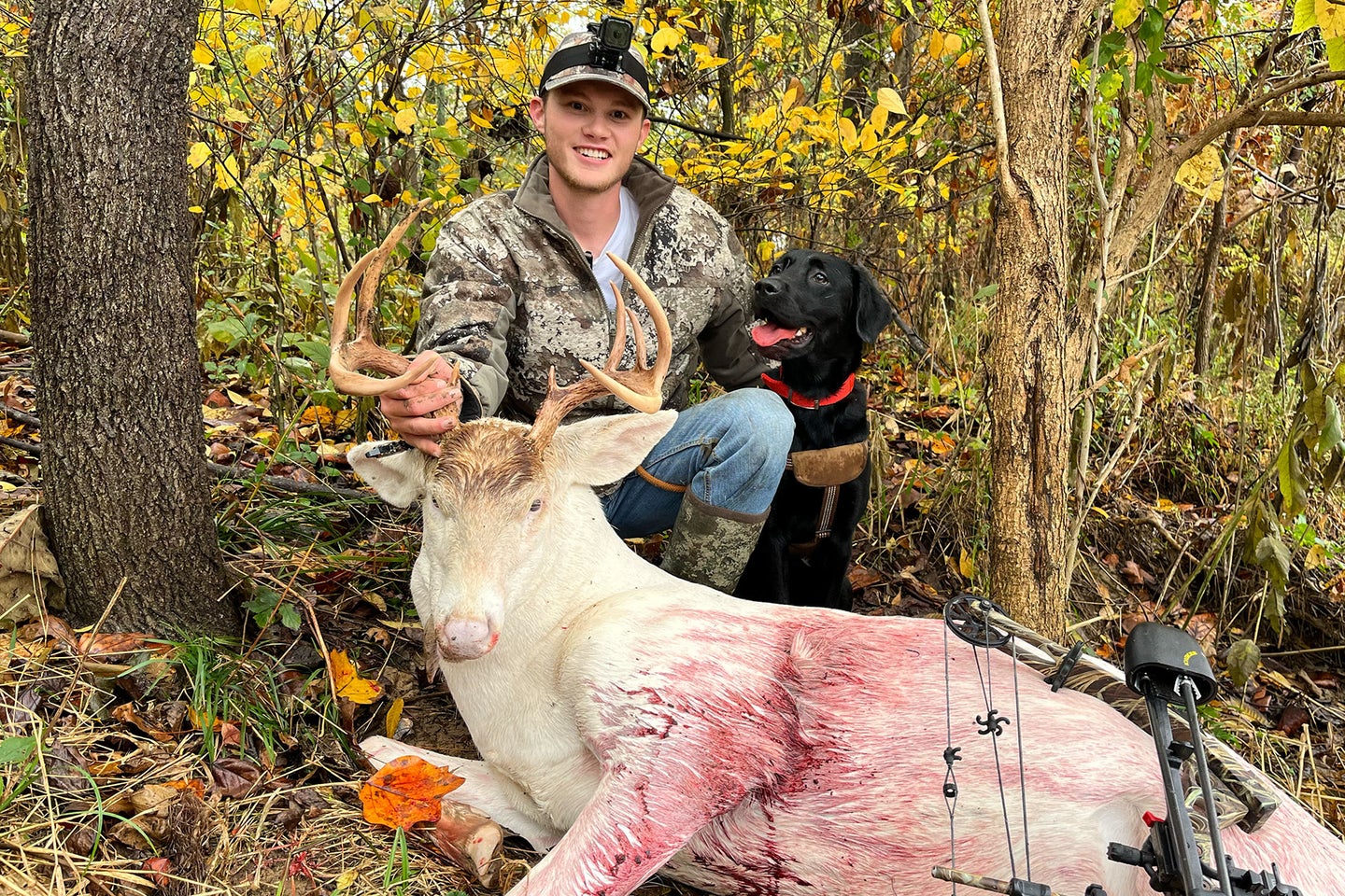 A young hunter poses with an albino whitetail buck tagged in southern Indiana.