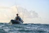A kayak angler fishing rough, open water