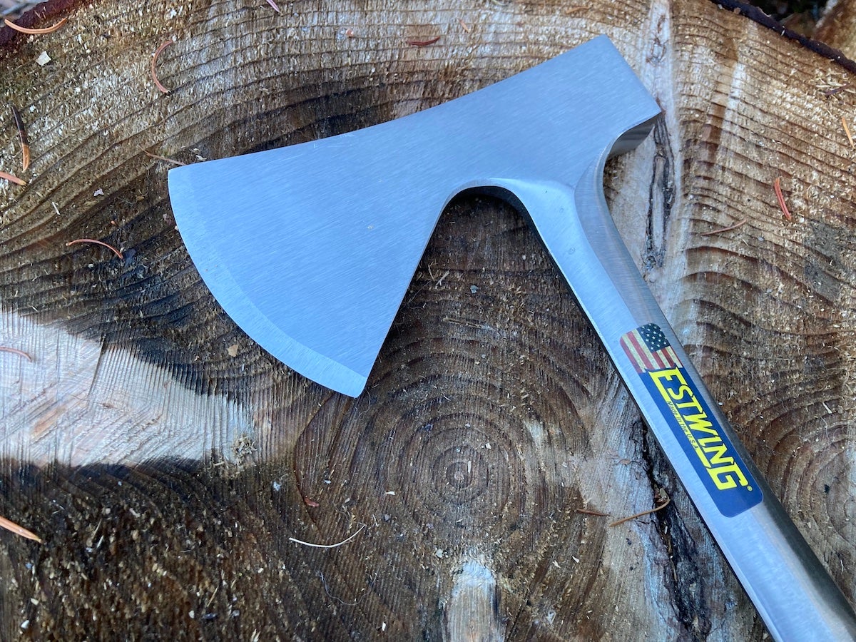 Estwing Long Handle Camper's Axe head laying on log