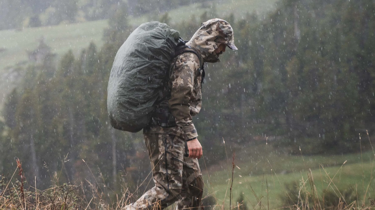 Hunter wearing KUIU Yukon TR Rain Gear Set in the field