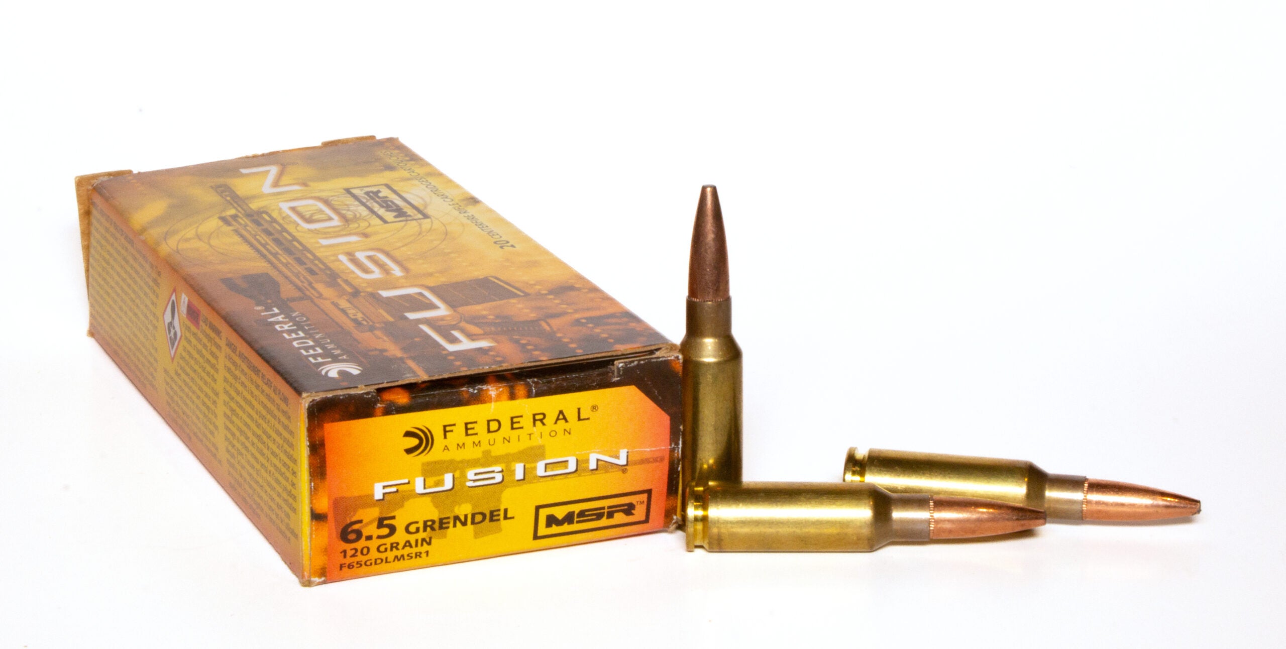 Box of 6.5 Grendel ammo with three loose cartridges on white background