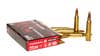 Box of 223 Remington ammo with five loose cartridges on white background
