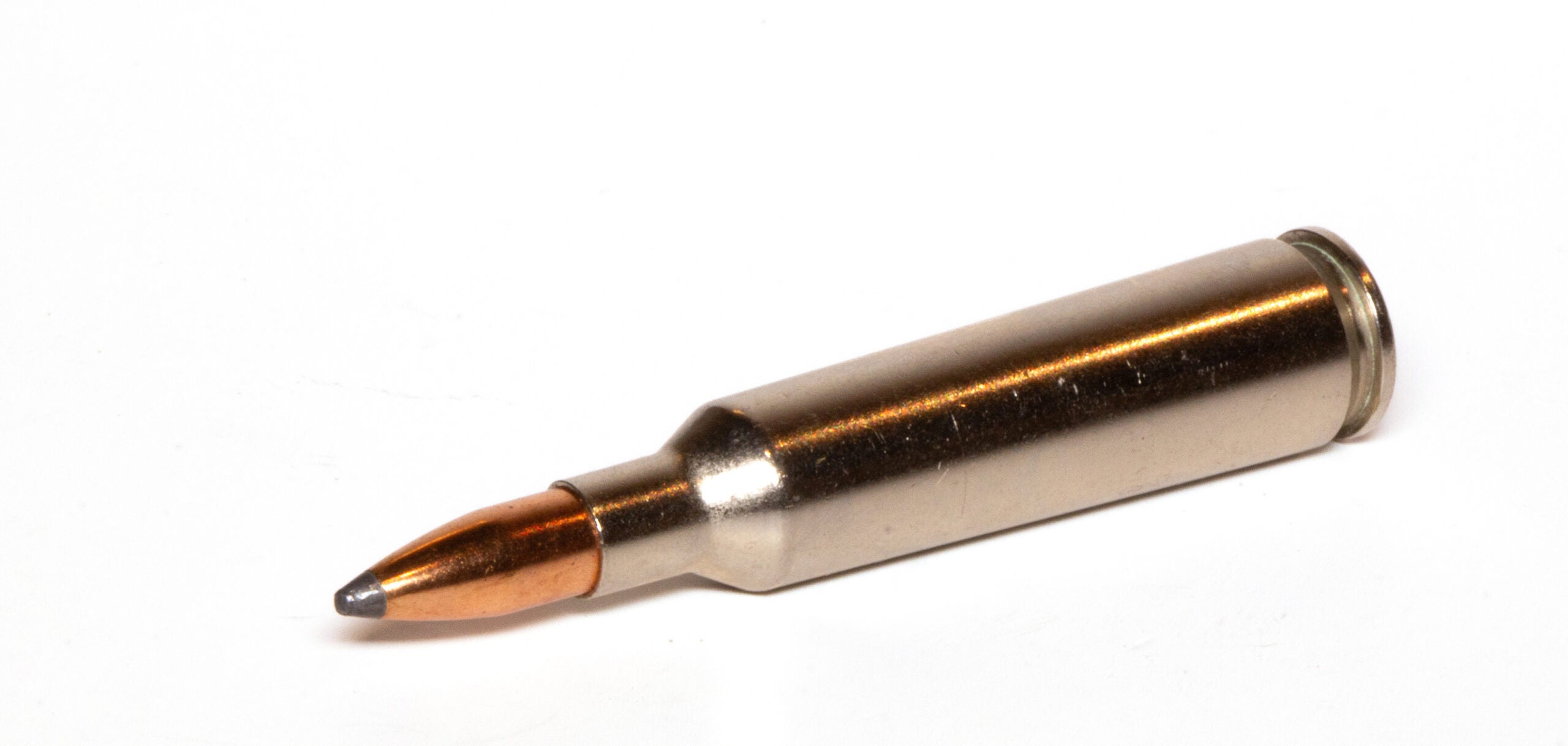 A 22-250 cartridge on white background