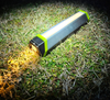 Goal Zero Torch flashlight lit up on the grass
