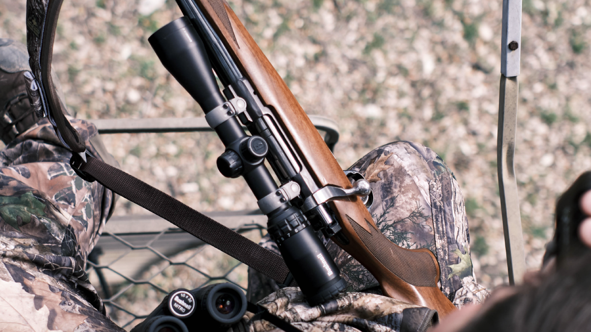 Bushnell Banner Rifle Scope on rifle in treestand