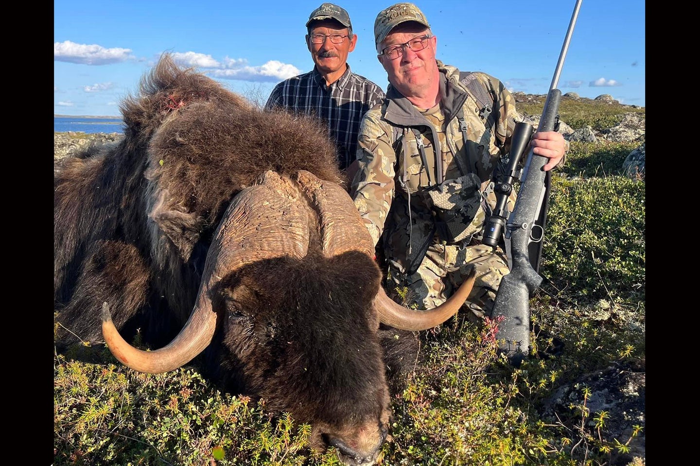 A hunter poses with a record-breaking musk ox.