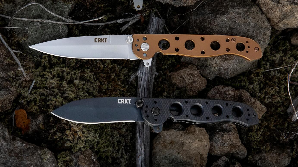 CRKT folding knives on rock outdoors