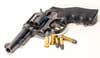 38 Special cartridge and S&W revolver of white background