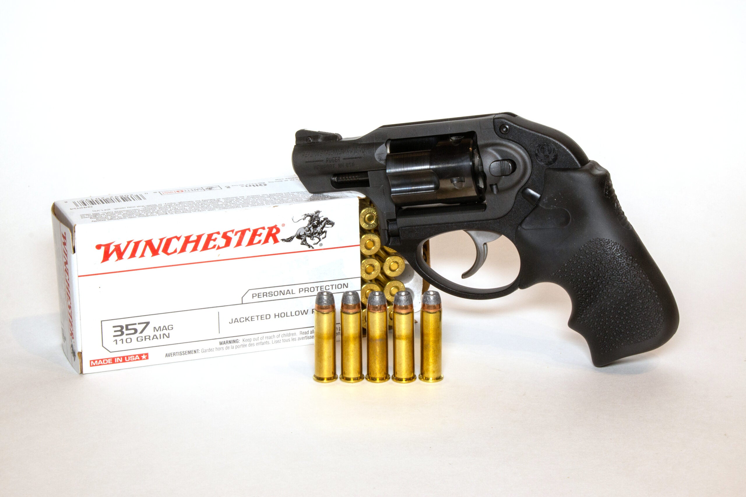 A box of 357 Magnum ammo and a snub-nose revolver on white background